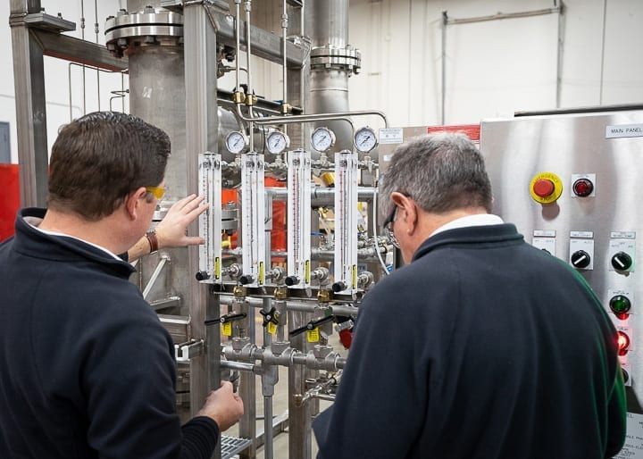Two process engineers discuss process systems design
